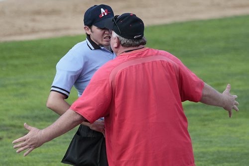 July 22, 2014 - 140722  -  Fargo-Moorhead RedHawks manager Doug Simunik gets in the face of the umpire after CJ Retherford (12) was called out against the Winnipeg Goldeyes in Winnipeg Tuesday, July 22, 2014.  John Woods / Winnipeg Free Press