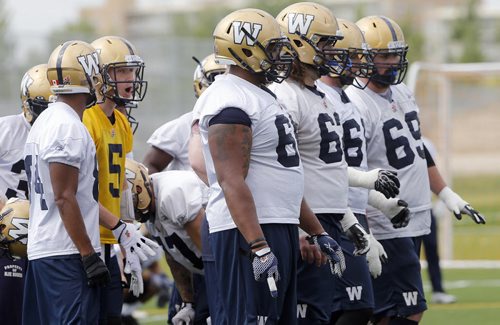 The O-Line will have to play better giving Drew Willy  time to throw and relestablish the running game  . Wpg Blue Bomber prepare for Friday's game in Vancouver vs the BC Lions  July 23 2014 / KEN GIGLIOTTI / WINNIPEG FREE PRESS