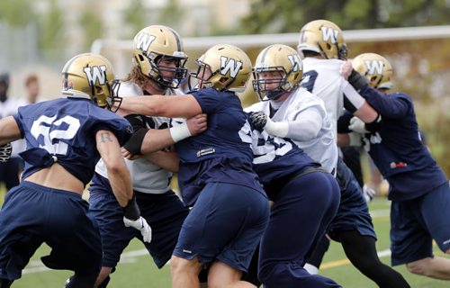 SPORTS . The offensive line will have to be better as Wpg Blue Bombers prepare for Friday game in Vancouver vs the BC Lions July 23 2014 / KEN GIGLIOTTI / WINNIPEG FREE PRESS