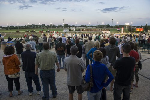 140723 Winnipeg - DAVID LIPNOWSKI / WINNIPEG FREE PRESS  Crowds watch live horse racing action at Assiniboia Downs Wednesday July 23, 2014.