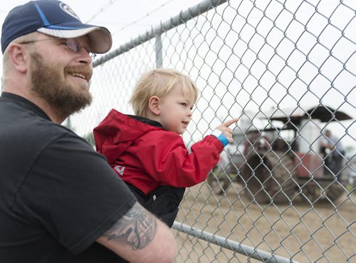 Rob MacDonald brings his son Alex, 4, to the 60th Manitoba Threshermen's Stampede in Austin on Thursday for the first time. Rob has not attended the stampede since he was a kid. Sarah Taylor / Winnipeg Free Press July 24, 2014