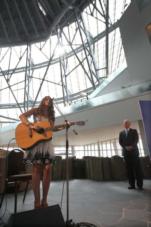 Sierra Noble plays at The Canadian Museum for Human Rights (CMHR) news conference as Stuart Murray President and CEO watches. It was announced its plans for a full slate of family friendly activities and performances planned for its official opening weekend. Opening-weekend public events will take place Saturday, September 20 and Sunday, September 21.-See Adam Wazny Story- July 24, 2014   (JOE BRYKSA / WINNIPEG FREE PRESS)