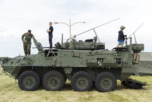 Corporal Dave Castellanos shows kids the Lav III at the 60th Manitoba Threshermen's Stampede in Austin on Thursday. Sarah Taylor / Winnipeg Free Press July 24, 2014