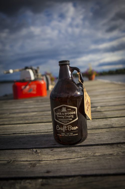 A growler bottle of Lake of the Woods craft beer sits on a dock in Kenora, Manitoba. Tom Thomson photo