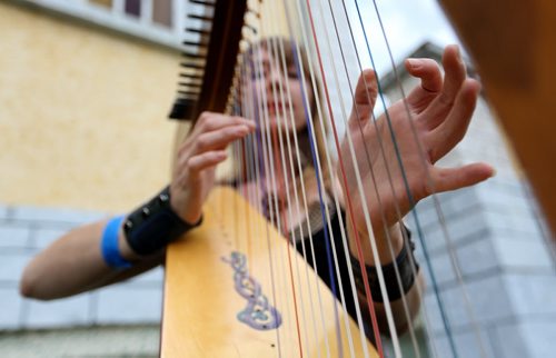 Sheila Grycki playing the harp at the Medieval Festival in Cooks Creek, Saturday, July 26, 2014. (TREVOR HAGAN/WINNIPEG FREE PRESS)