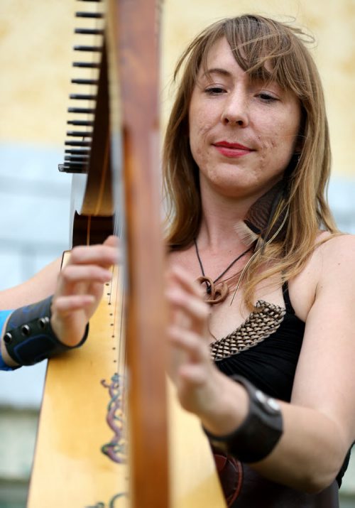 Sheila Grycki playing the harp at the Medieval Festival in Cooks Creek, Saturday, July 26, 2014. (TREVOR HAGAN/WINNIPEG FREE PRESS)