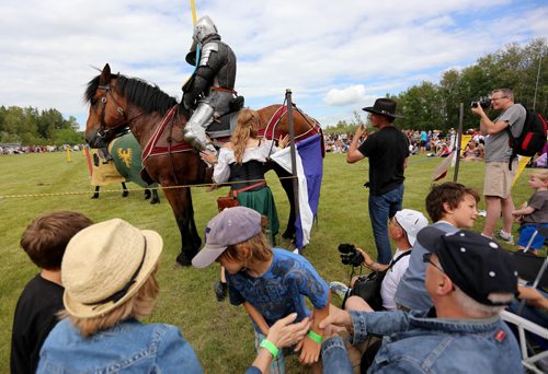 Spectators are forced to quickly move as a horse gets a little bit too close during a jousting competition at the Medieval Festival in Cooks Creek, Saturday, July 26, 2014. (TREVOR HAGAN/WINNIPEG FREE PRESS)