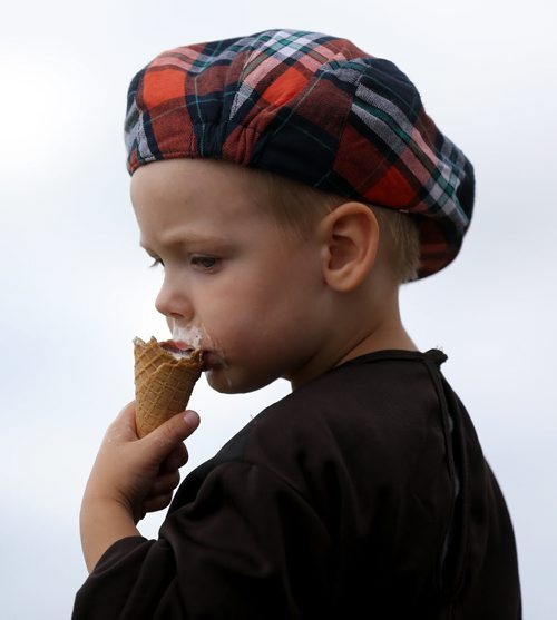 Kai Schellenberg, 4, from St. Pierre, enjoying some ice cream, at the Medieval Festival in Cooks Creek, Saturday, July 26, 2014. (TREVOR HAGAN/WINNIPEG FREE PRESS)