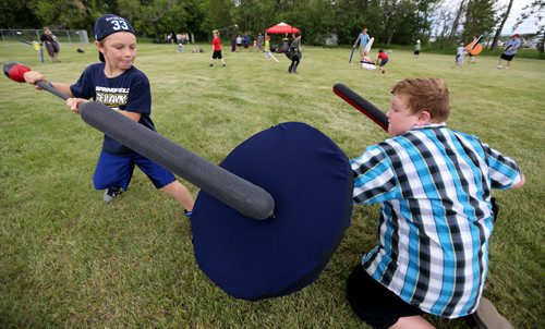 Hayden Evans, 8. from Oakbank and Aidan Tullock, 10, from Winnipeg, battling at the Medieval Festival in Cooks Creek, Saturday, July 26, 2014. (TREVOR HAGAN/WINNIPEG FREE PRESS)