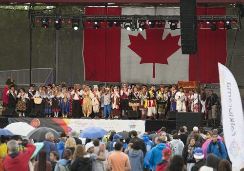 The Folklorama pavilions gather on the Festival Park Stage at the Forks on Saturday evening for Folklorama Kick-Off. Sarah Taylor / Winnipeg Free Press July 26, 2014