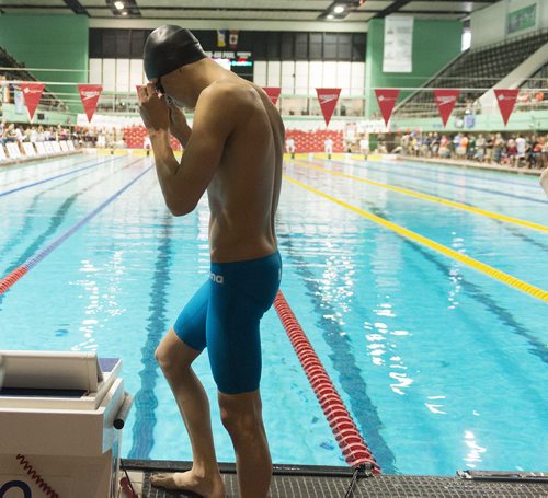 Manta swimmer Simon Meier prepares for his 200 breaststroke race at Pam Am Pool on Saturday. Sarah Taylor / Winnipeg Free Press July 26, 2014