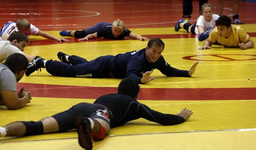 Sports . Russian Olympic Wrestler Sergei Belogazov puts on wrestling camp .In pic leading warm up  for the group . July 28 2014 / KEN GIGLIOTTI / WINNIPEG FREE PRESS