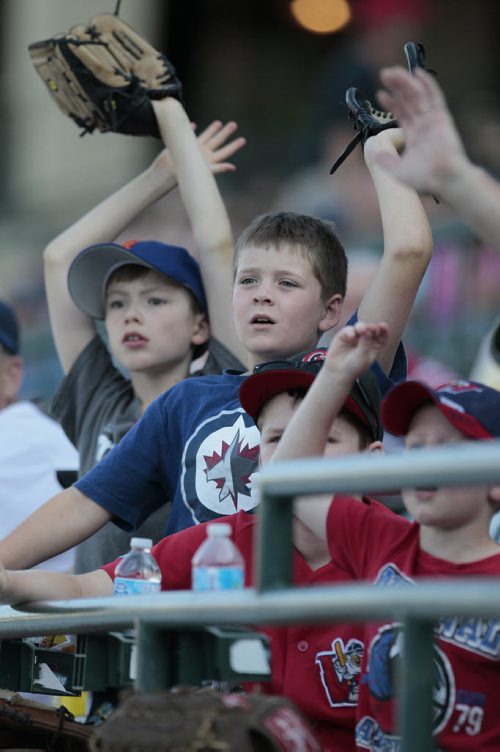 July 28, 2014 - 140728  -  Young fans reach up for a pop ball at the All Stars Skills Competition in Winnipeg Monday, July 28, 2014.  John Woods / Winnipeg Free Press