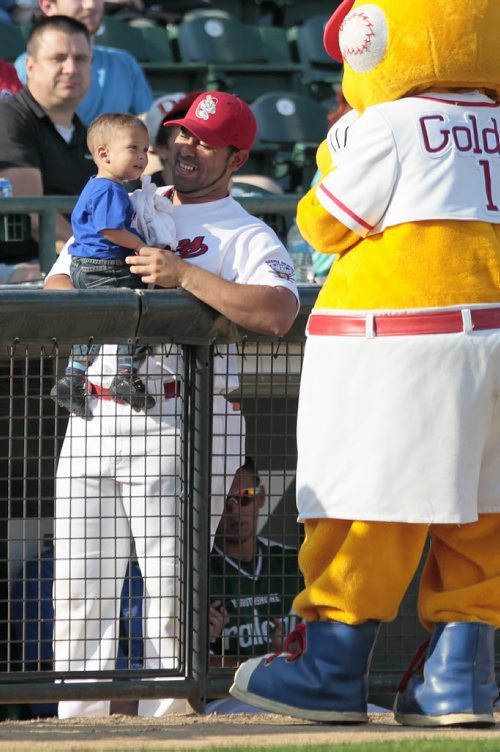 July 28, 2014 - 140728  -  Winnipeg Goldeyes mascot plays with Goldeyes catcher Luis Allen and a baby at the All Stars Skills Competition in Winnipeg Monday, July 28, 2014.  John Woods / Winnipeg Free Press