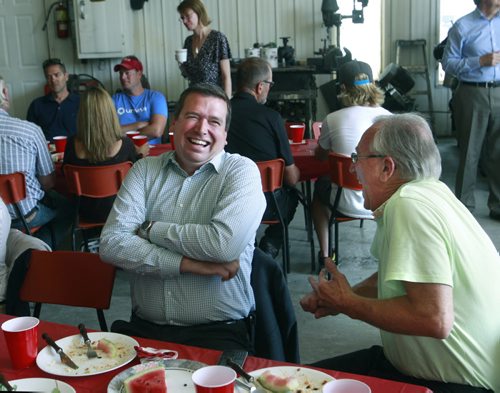 At left, Christian Paradis, Federal Minister for International Development chats with Art Enns,  who farms near  Arnaud, MB  during a  meeting with farmer-members of Canadian Foodgrains Bank on a farm Tuesday in Arnaud, MB. Carol Sanders story Wayne Glowacki / Winnipeg Free Press July 29  2014