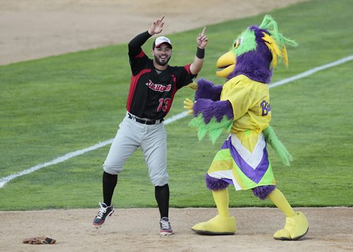July 29, 2014 - 140729  - Grand Prairie Air Hogs Adel Nieves jokes around with a mascot in the 2014 American Association All-Star game in Winnipeg Tuesday, July 29, 2014.  John Woods / Winnipeg Free Press