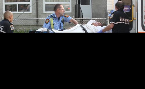 A Winnipeg Fire  Deppartement First Respondersand EMS rush a man to hospital in a stabbing incident at 293 Alfred Ave Wednesday Breaking News- July 30, 2014   (JOE BRYKSA / WINNIPEG FREE PRESS)