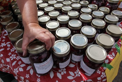 For weekend photo page. 
Betty Jagodnik of Grammie's Jams, Jellies and Preserves, organizes her jars during the Farmers Market at The Forks Sunday morning. for Borders page 140727 - Wednesday, July 30, 2014 -  (MIKE DEAL / WINNIPEG FREE PRESS)