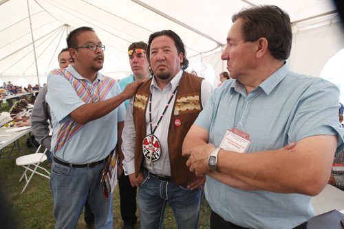 Derek Nepinak, centre, is congratulated after being re-voted in the first ballot as the Grand Chief for the Assemble of Manitoba Chiefs Wednesday afternoon See Alex Paul Story- July 30, 2014   (JOE BRYKSA / WINNIPEG FREE PRESS)