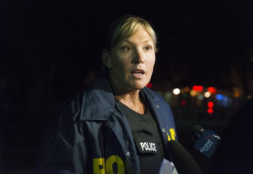 Sargent Natalie Aitken speaks at Stella Avenue ongoing standoff on Wednesday night. Sarah Taylor / Winnipeg Free Press July 30, 2014