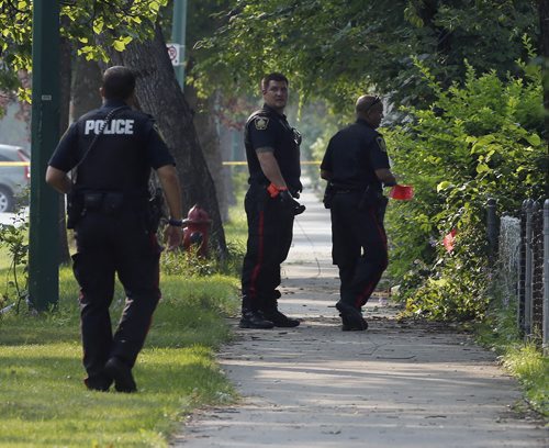 Wpg Police continue to investigate a house in the 500 Block of Stella Ave after an all night standoff . The Standoff ended around 3:40 am after 17 hours. July 31 2014 / KEN GIGLIOTTI / WINNIPEG FREE PRESS