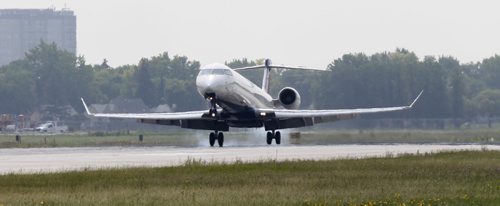 Filer.  A Delta jet lands on runway 13/31 (not the newly resurfaced 18/36 runway) at Winnipeg's James Richardson International Airport.  Murray McNeil story. lWayne Glowacki/Winnipeg Free Press July 31 2014