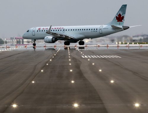 An Air Canada jet on runway 13/31 travels through the intersection of the newly resurfaced 18/36 runway. Winnipeg Airports Authority give¤¤a media tour Thursday morning of the newly completed Runway 18/36 at the¤James Richardson International Airport  which will help reduce the number of planes flying over homes in River Heights. Murray McNeill story, Wayne Glowacki/Winnipeg Free Press July 31 2014