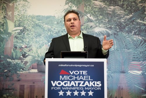 Mayoral candidate Michael Vogiatzakis announces he would set business tax revenue for finance business growth and cap the total amount the city collects. At Voyage Funeral Home on Friday morning. 140801 - Friday, August 01, 2014 - (Melissa Tait / Winnipeg Free Press)