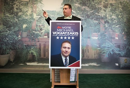 Mayoral candidate Michael Vogiatzakis announces he would set business tax revenue for finance business growth and cap the total amount the city collects. At Voyage Funeral Home on Friday morning. 140801 - Friday, August 01, 2014 - (Melissa Tait / Winnipeg Free Press)