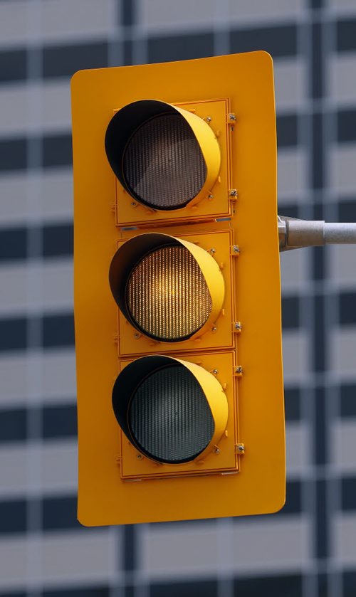 TRaffic light with yellow background , some light have a black background  . Traffic light and road safety  story by Mary Agnes Welch  Aug 1 2014 / KEN GIGLIOTTI / WINNIPEG FREE PRESS