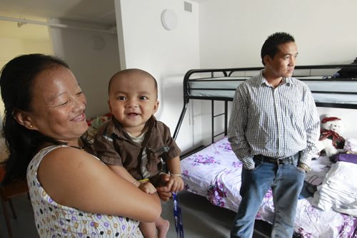 Laxman Bhujel with wife Sukhamina Rai and son Ryan (one of their two children) in their small  apartment in Welcome Place in Winnipeg. Carol Sanders story. Wayne Glowacki/Winnipeg Free Press August 1 2014