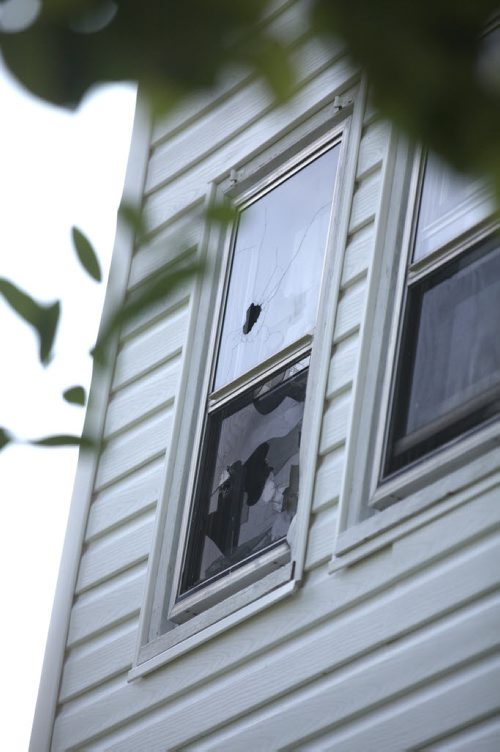 Photo of 512 Stella,  Home where Andrew Baryluk lived before he died following a 17-hour standoff with Winnipeg Police after he had been embroiled in a family dispute over the house. Bullet holes in upstairs window   See story.   Aug 02, 2014 Ruth Bonneville / Winnipeg Free Press