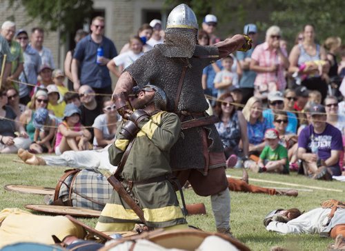 The blacksmith was the last man standing in the Viking Reenactment Battle at the Icelandic Festival of Manitoba in Gimli on Saturday. Sarah Taylor / Winnipeg Free Press August 02, 2014