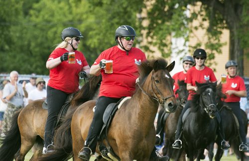 The Icelandic Horse Demo Team raise their beers after completing the tolt gait which is natural to the Icelandic horses. It is a fast but smooth gait where the riders hold a mug of beer without spilling a drop. Sarah Taylor / Winnipeg Free Press