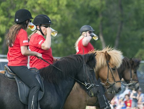 The Icelandic Horse Demo Team drink their beers after completing the tolt gait which is natural to the Icelandic horses. It is a fast but smooth gait where the riders hold a mug of beer without spilling a drop. Sarah Taylor / Winnipeg Free Press