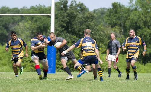 140803 Winnipeg - DAVID LIPNOWSKI / WINNIPEG FREE PRESS  The Highlanders (grey) battled the Saracens (yellow and blue) during SNAFU 44 Rugby Tournament at Maple Grove Rugby Park  Sunday August 3, 2014.