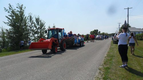 The parade in its 16th year started with tractors and has grown to an annual spectacle and once-a-year traffic jam on the island. For Sanders story. CAROL SANDERS PHOTO