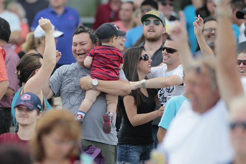 
August 4, 2014 - 140804  -  Happy fans celebrate a win after a race at Assiniboine Downs in Winnipeg Monday, August 4, 2014.  John Woods / Winnipeg Free Press
