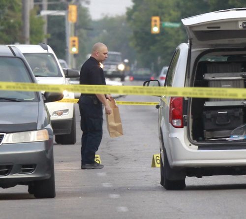 Winnipeg Police investigate the reported early morning assault on Selkirk Ave. Tuesday morning. Police closed Selkirk Ave. at Sinclair Ave. and Battery Ave. Wayne Glowacki/Winnipeg Free Press Aug.5 2014