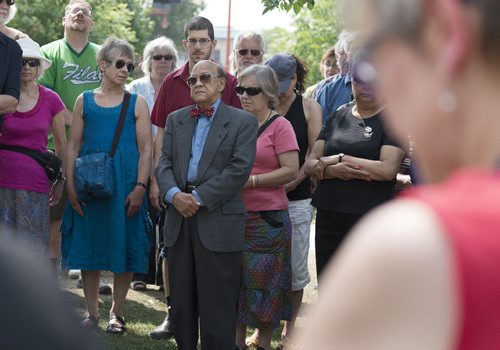 President of Mahatma Gandhi Centre of Canada Dr. K Dakshinamurti gather with multi-faith and human right groups for a circle of silent contemplation at the Forks Gandhi statue onTuesday afternoon to reflect on the violence happening in places such as Gaza, Ukraine and support peace. Sarah Taylor / Winnipeg Free Press August 5, 2014