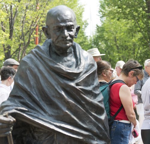 Organizer Lynda Trono gathered with multi-faith and human right groups for a circle of silent contemplation at the Forks Gandhi statue onTuesday afternoon to reflect on the violence happening in places such as Gaza, Ukraine and support peace. Trono plans to continue this circle every Tuesday. Sarah Taylor / Winnipeg Free Press August 5, 2014