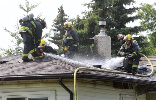 Winnipeg Fire Fighters had to return to 639 Muriel St. Tuesday afternoon after smoke was seen coming from the house. Fire crews attended to a fire at the house Monday night. See story.Wayne Glowacki/Winnipeg Free Press Aug. 5 2014