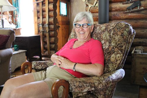 008 - Clarice Gilchrist at her Clear Lake cottage built from pine logs in the 1930s. BILL REDEKOP/WINNIPEG FREE PRESS Aug 5,2014