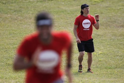 August 5, 2014 - 140805  - Johnny Fukomoto, owner of Fukomoto Fitness, encourages participants in his fitness class as they run up the hill at Kildonan East Collegiate in preparation for an adventure race Tuesday, August 5, 2014.  John Woods / Winnipeg Free Press
