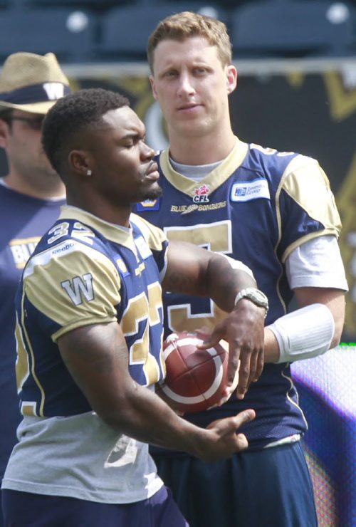 Winnipeg Blue Bombers  QB Drew Willy and  # 32 Nic Grigsby RB at the team's walk through at the Investors Group Field Wednesday.  Melissa Martin/ Gary Lawless stories.  Wayne Glowacki/Winnipeg Free Press August 6 2014