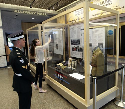 Corporal John Nichol with the Gov. General's Foot Guards looks at the display case in the foyer of the Manitoba Museum Wednesday morning where the Victoria Cross Medals will be displayed. The opening ceremonies for the Valour Road Victoria Cross Medal groupings was Wednesday afternoon in the  Alloway Hall of The Manitoba Museum. Wayne Glowacki/Winnipeg Free Press August 6 2014