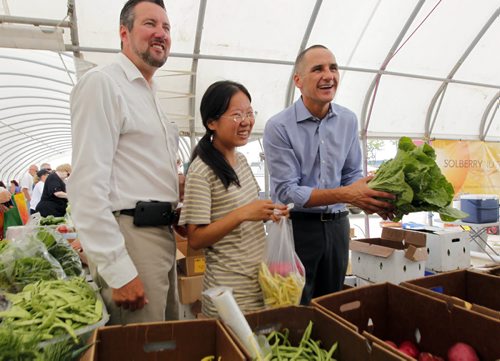 LOCAL - St. Norbert Farmers Market gets a boost from the government to improve their facilities at the popular market. Dave Gaudreau, NDP-St. Norbert, market farmer Ming Zhai, and NDP Kevin Chief pose for some photos in the market . BORIS MINKEVICH / WINNIPEG FREE PRESS  August 6, 2014