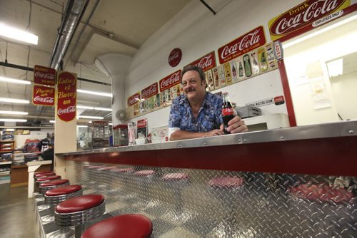 Dave Sanderson story on Thirsty's Flea Market, the only flea market in town that's open five days a week (Wedn thru Sun).  Photo of Richard "Thirsty" Copet  who runs  the  flea market and the  market's 60s-style lunch counter, which is decorated with soda pop signs from Richard's personal collection (he collects soda pop, that's why they call him Thirsty...)   Aug 02, 2014 Ruth Bonneville / Winnipeg Free Press