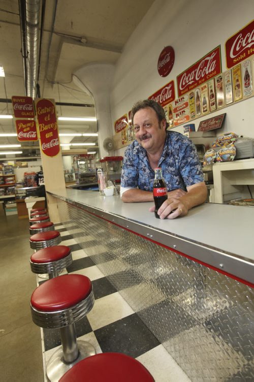 Dave Sanderson story on Thirsty's Flea Market, the only flea market in town that's open five days a week (Wedn thru Sun).  Photo of Richard "Thirsty" Copet  who runs  the  flea market and the  market's 60s-style lunch counter, which is decorated with soda pop signs from Richard's personal collection (he collects soda pop, that's why they call him Thirsty...)   Aug 02, 2014 Ruth Bonneville / Winnipeg Free Press
