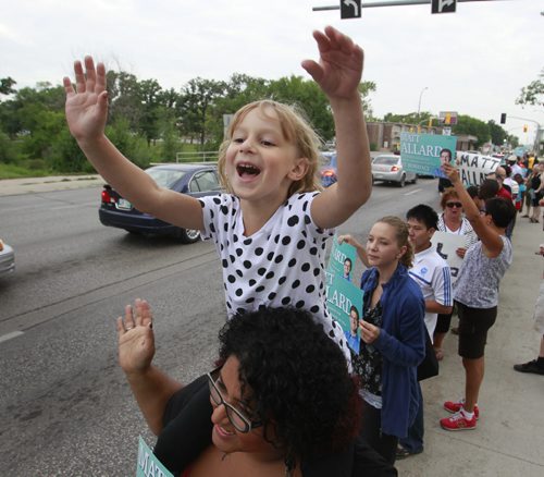 Camille,5, was out Thursday morning waving to commuters on Rue Archibald along with about 65 supporters of her father Matt Allard who is running for city councillor of St. Boniface in the up coming civic election.  see release.  Wayne Glowacki/Winnipeg Free Press August 7 2014
